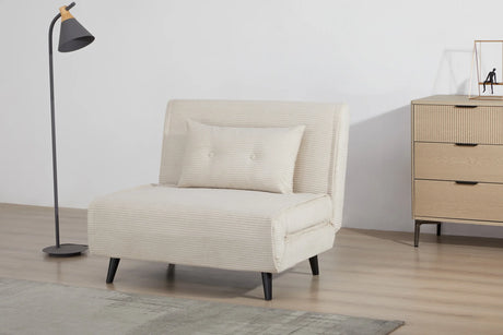 Rozkładany fotel tapicerowany sztruksem w kolorze beżowym na czarnych nóżkach do salonu, sypialni