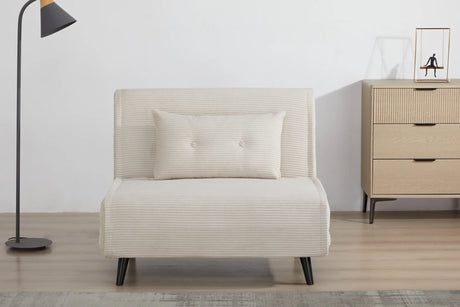 Rozkładany fotel tapicerowany sztruksem w kolorze beżowym na czarnych nóżkach do salonu, sypialni