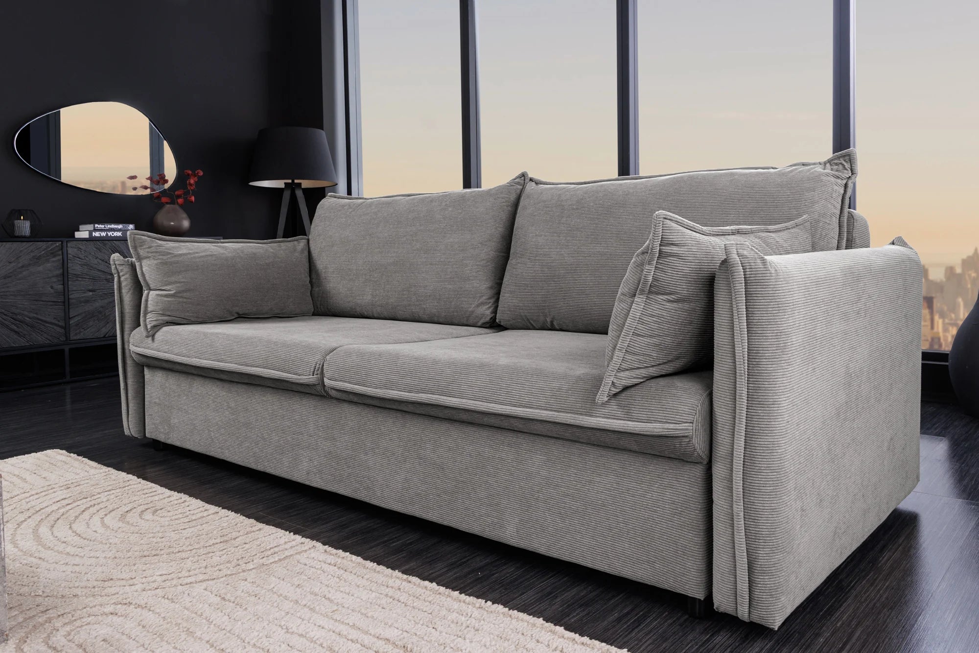 Rozkładana sofa sztruksowa w kolorze szarym – nowoczesna i wygodna do salonu