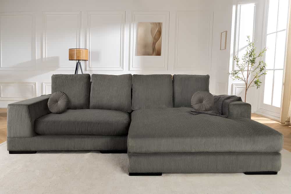 Sofa narożna w nowoczesnym stylu z poduszkami i elastycznym montażem otomany