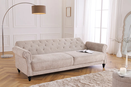 Trzyosobowa sofa w stylu klasycznym z tkaniny boucle, z pikowaniem, drewnianymi nogami i funkcją spania.