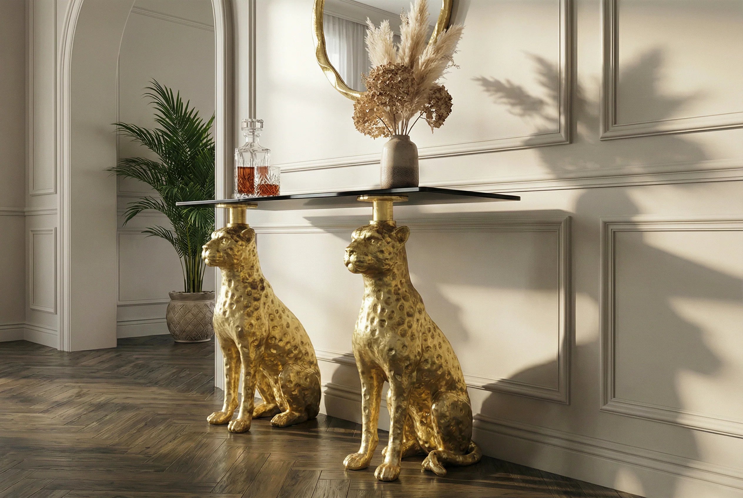 Luksusowa, nowoczesna konsola z czarnym marmurowym blatem i złotą podstawą.