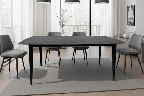 Stół do jadalni o marmurowym wykończeniu i smukłymi, czarnymi nogami elegancki design w stylu nowoczesnym.