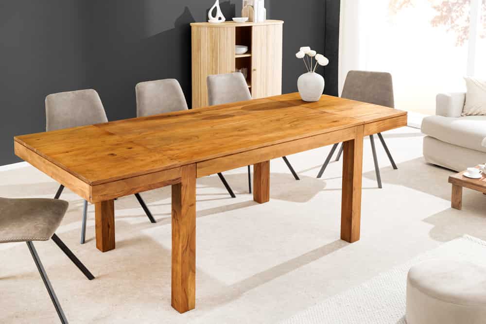 Drewniany stół do jadalni PURE rozkładany 120–200 cm z litej akacji w kolorze miodowym, z dodatkowymi blatami, model 47097 Invicta Interior.