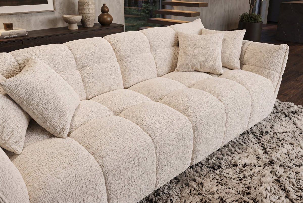 Beżowa sofa CLOUD w tkaninie boucle o miękkiej zaokrąglonej formie do nowoczesnego salonu