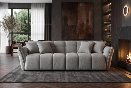 Szara sofa CLOUD w tkaninie bouclé o miękkiej zaokrąglonej formie do nowoczesnego salonu