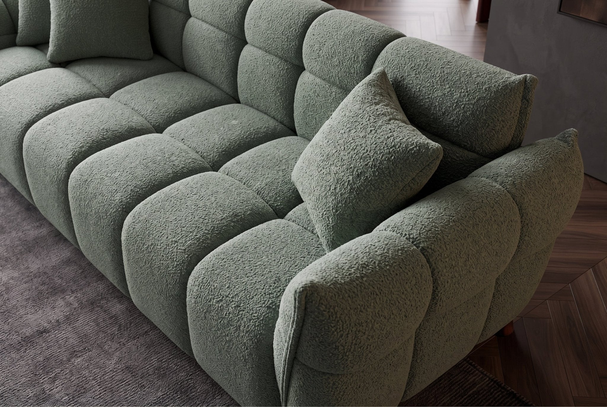 Zielona sofa CLOUD w tkaninie bouclé o miękkiej zaokrąglonej formie do nowoczesnego salonu