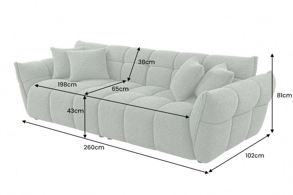 Zielona sofa CLOUD w tkaninie bouclé o miękkiej zaokrąglonej formie do nowoczesnego salonu