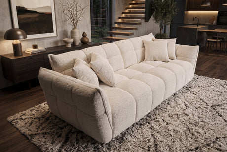 Beżowa sofa CLOUD w tkaninie boucle o miękkiej zaokrąglonej formie do nowoczesnego salonu