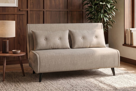 Beżowa sofa z funkcją spania 140 cm w tkaninie aksamit z drewnianymi nóżkami i poduszkami