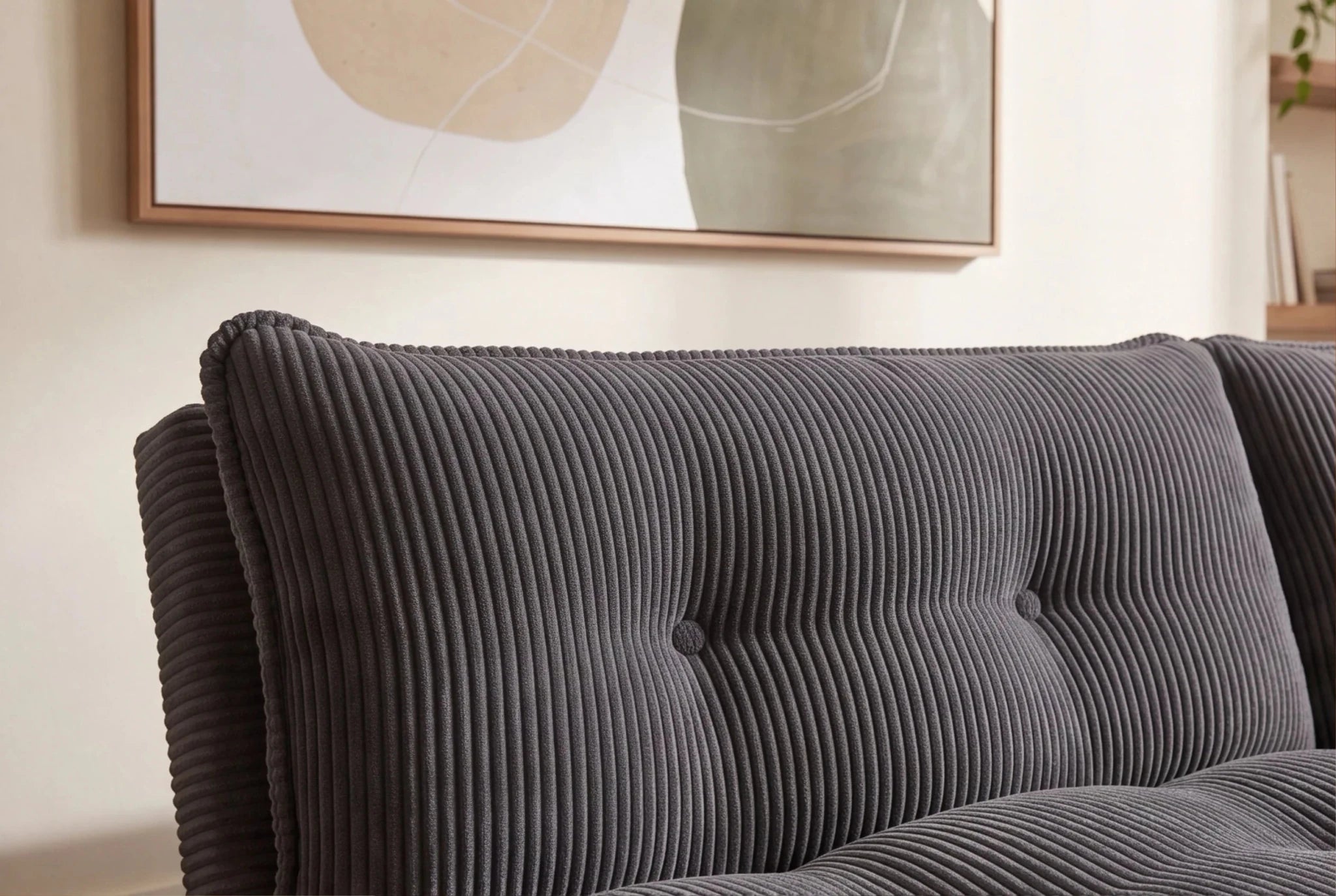 Szara sofa rozkładana 190 cm z tapicerką sztruksową i czarnymi nogami drewnianymi