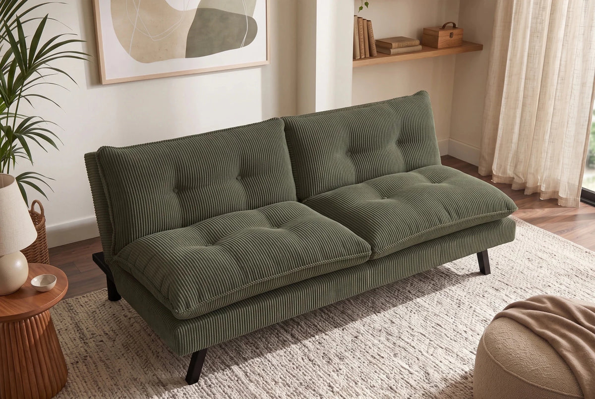 Zielona sofa rozkładana 190 cm z tapicerką sztruksową i czarnymi nogami drewnianymi