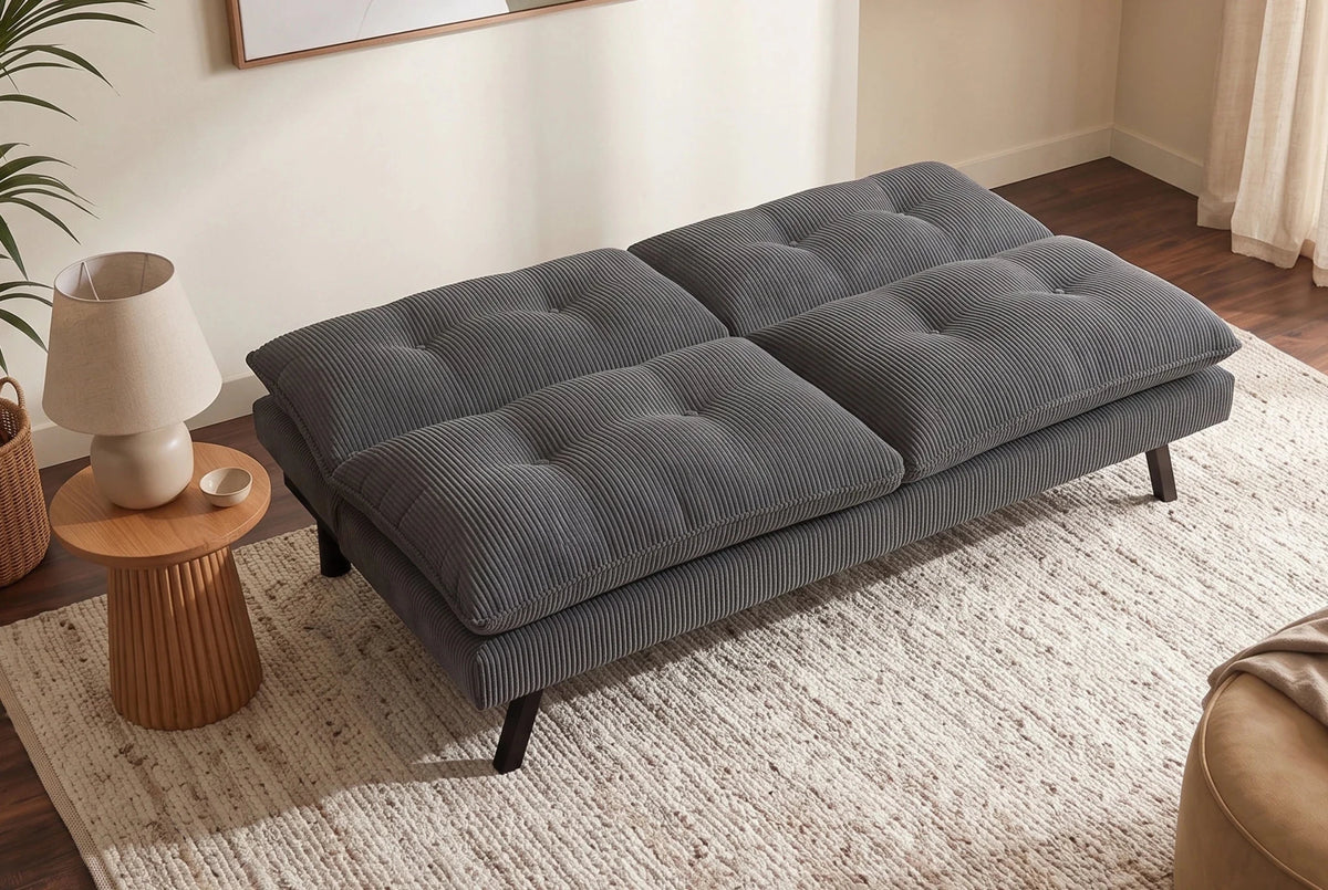 Szara sofa rozkładana 190 cm z tapicerką sztruksową i czarnymi nogami drewnianymi