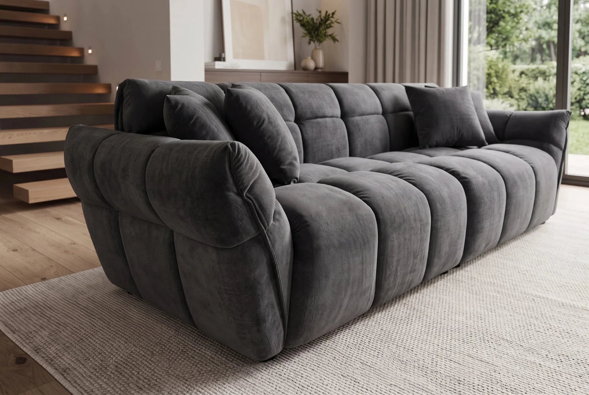Ciemnoszara sofa CLOUD w tkaninie velvet o zaokrąglonej formie do nowoczesnego salonu