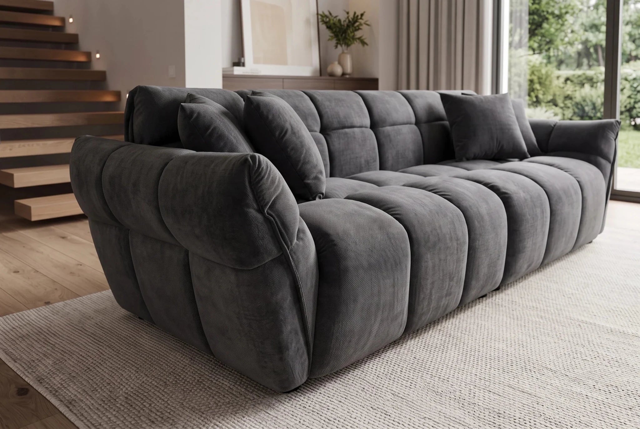 Ciemnoszara sofa CLOUD w tkaninie velvet o zaokrąglonej formie do nowoczesnego salonu