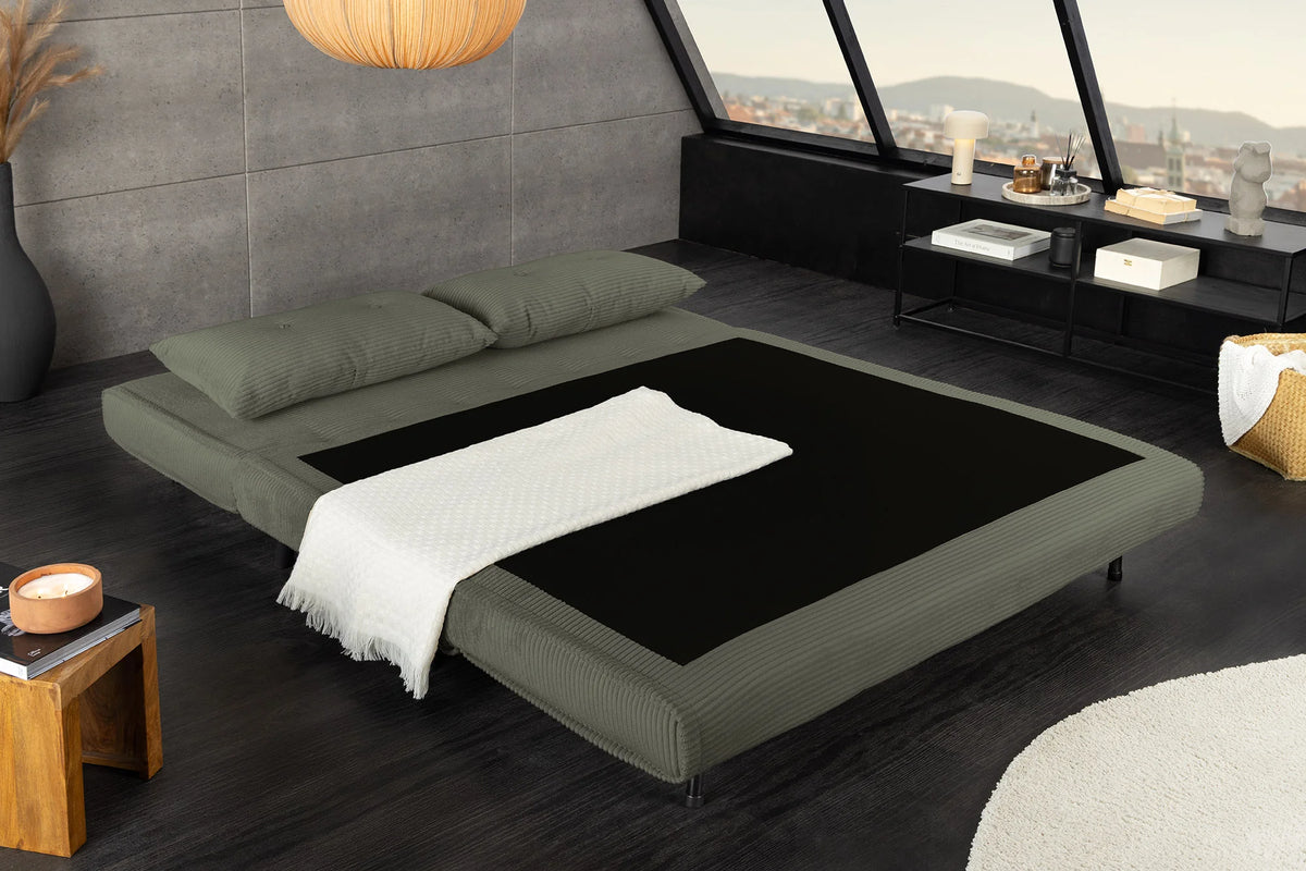 Sofa rozkładana zielona 140 cm do nowoczesnego salonu.